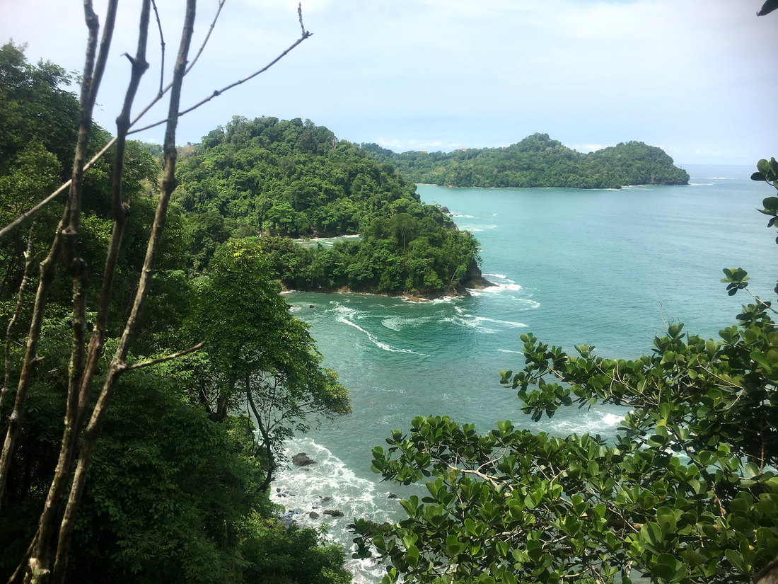 View from the trail over the turquoise sea and islands of Manuel Antonio