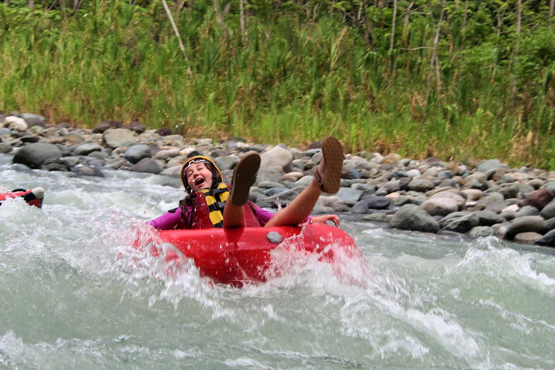 Guest laughing in a tube on the Savegre